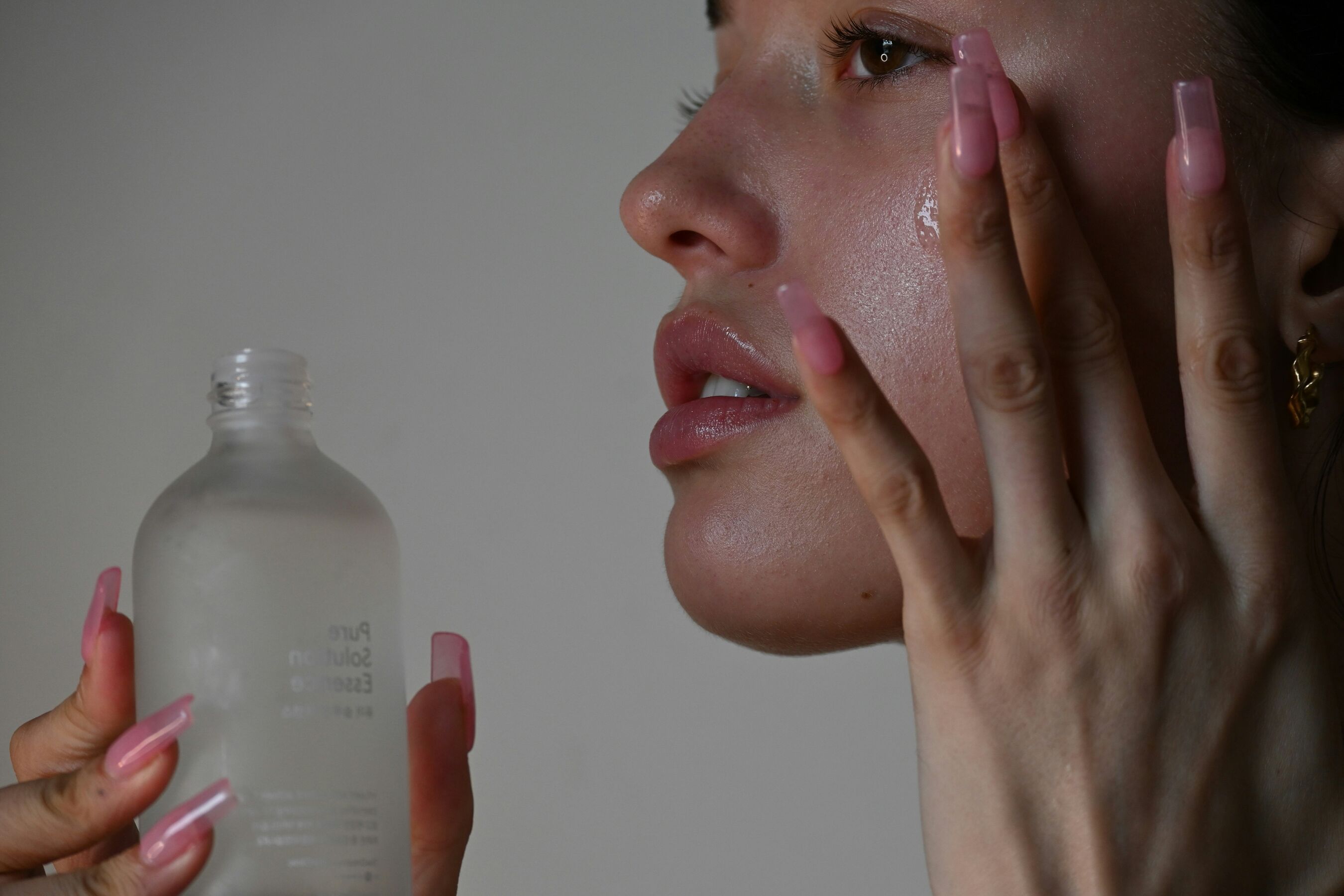 Woman applying skincare